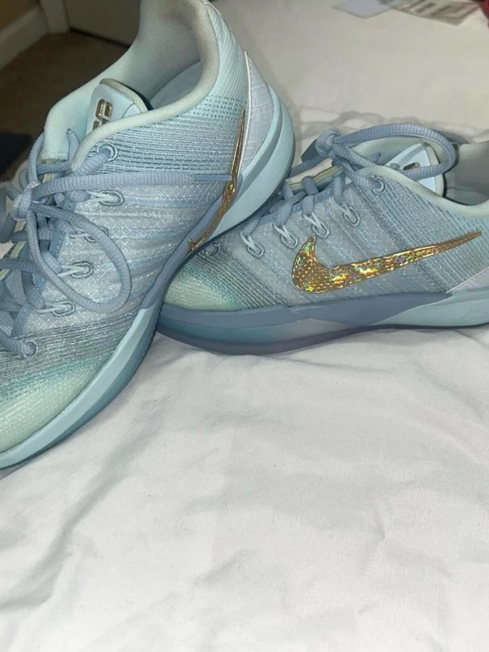 Nike Women's Light Blue Sneakers with Iridescent Gold Swoosh